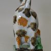 Prattware pottery hobbled cow creamer, circa 1820