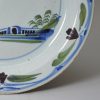 London delft pancake plate painted in blue, green and dark manganese, circa 1740