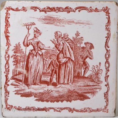 Liverpool delft tile decorated with a red Sadler print depicting and old woman reading a young girls hand, circa 1770