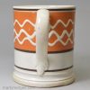 Small mocha ware mug decorated with slip over a pearlware glaze, circa 1830