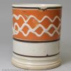 Small mocha ware mug decorated with slip over a pearlware glaze, circa 1830