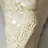 Creamware pottery wall pocket moulded with a Bacchanalian boy, circa 1770