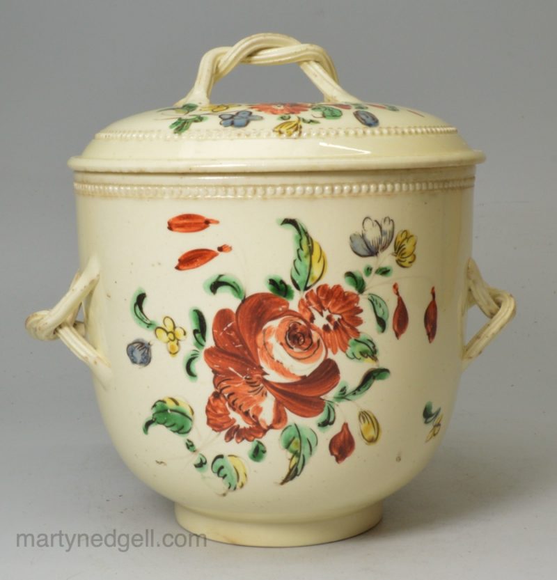 Creamware pottery sugar bowl and cover decorated with enamels over the glaze, circa 1770