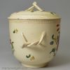 Creamware pottery sugar bowl and cover decorated with enamels over the glaze, circa 1770