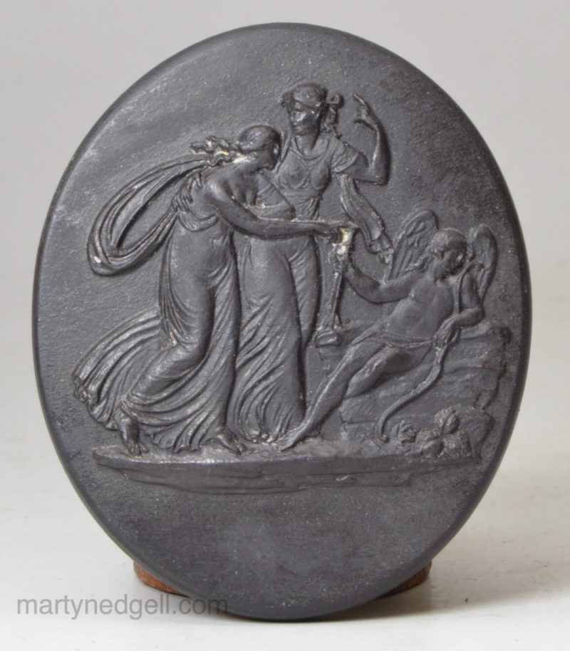 Small Wedgwood basalt plaque moulded with classical figures, circa 1800