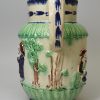 Pearlware pottery jug moulded with the Parson, Clerk and Sexton, and decorated with blue and green under the glaze, circa 1790, possibly Wood Family