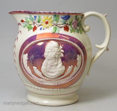 Pearlware pottery commemorative jug moulded with Queen Caroline and decorated with pink lustre, circa 1821