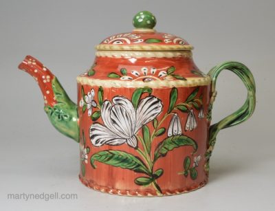 Creamware pottery teapot decorated with enamels of the glaze, circa 1770