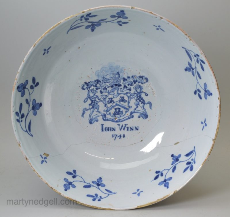 London delft footed bowl decorated with full coat of arms of the Coachmaker's company for John Winn in 1741