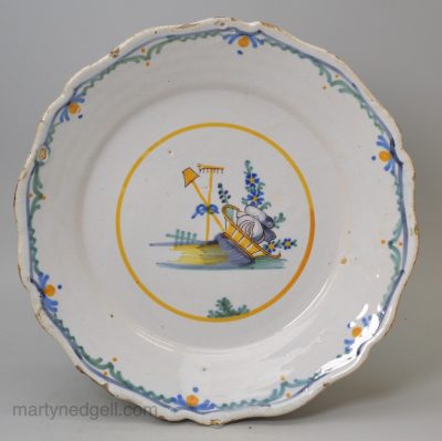 French tin glazed revolutionary plate painted with a scene representing the agricultural worker tied to the hat of Liberty, circa 1790, probably Nevers Pottery