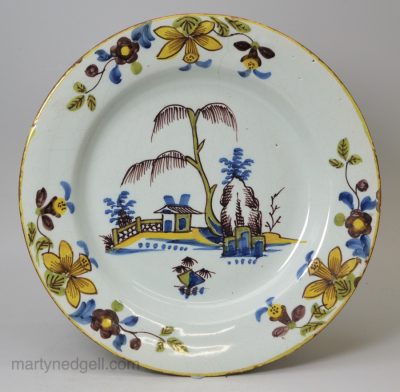 London delft polychrome plate with daffodil border, circa 1740