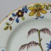 London delft polychrome plate with daffodil border, circa 1740