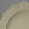 Creamware pottery dinner plate with a moulded border, circa 1780