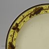 Small creamware plate decorated with a painted border, circa 1790