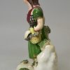 Pearlware pottery figure of a Scottish girl, circa 1830, probably Scottish Pottery