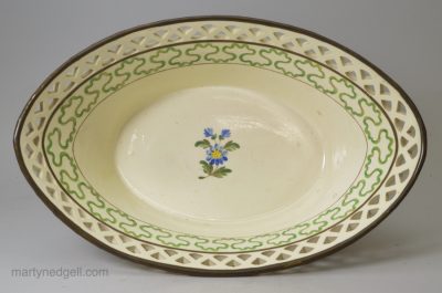 Creamware pottery basket decorated with enamels over the glaze, circa 1800