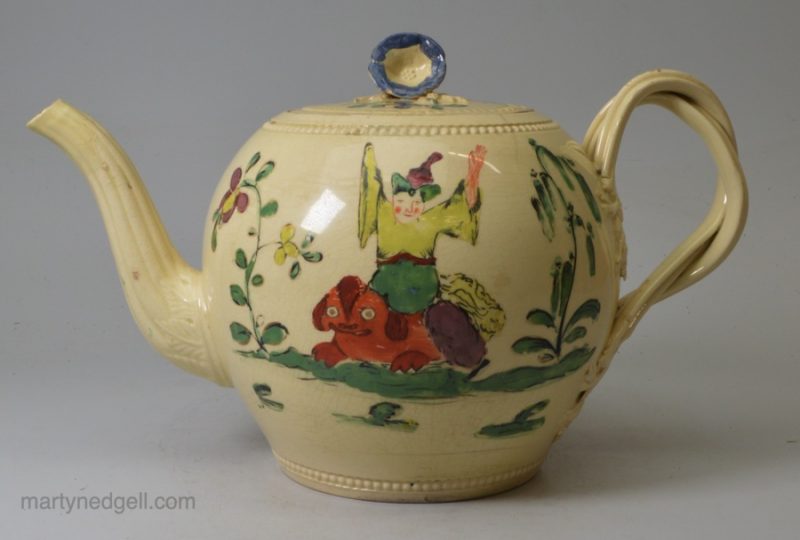 Creamware pottery teapot decorated with Chinese figures in enamels over the glaze, circa 1770, possibly Leeds Pottery