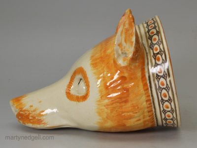 Large creamware pottery fox head stirrup cup decorated with colours under the glaze, Prattware, circa 1820