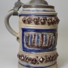 Westerwald saltglaze stoneware tankard decorated with moulded town views, circa 1680