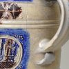 Westerwald saltglaze stoneware tankard decorated with moulded town views, circa 1680