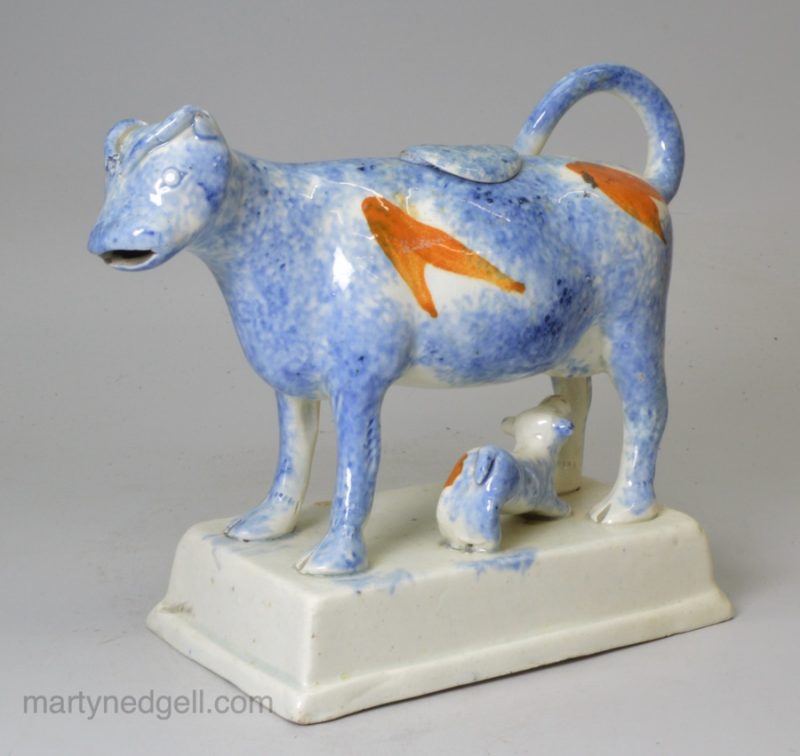 Pearlware pottery cow creamer with sponge decoration under the glaze, circa 1820