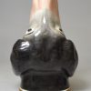 Staffordshire pottery hounds head stirrup cup, circa 1850