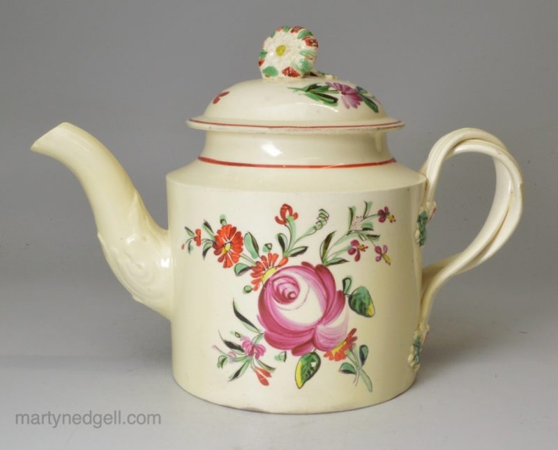 Creamware pottery teapot decorated with enamels over the glaze, circa 1780