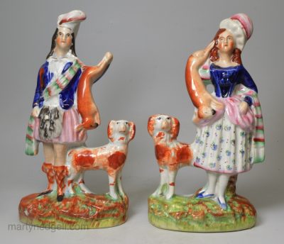 Pair of Victorian Staffordshire figures of Scottish hunters, circa 1860