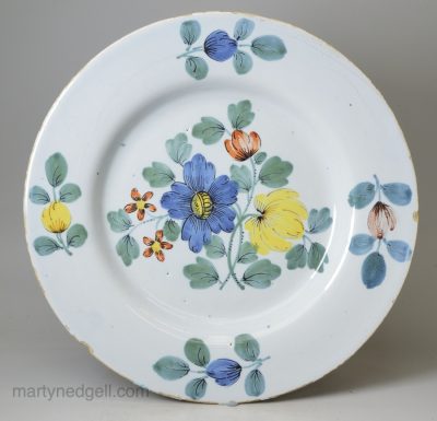 Liverpool delft plate decorated with flowers in a Fazackerly palette, circa 1750