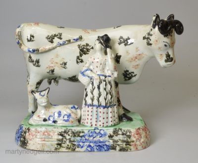 Prattware pottery model of a cow, calf and attendant, circa 1820