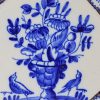 London delft tile decorated in blue and powder manganese, circa 1740