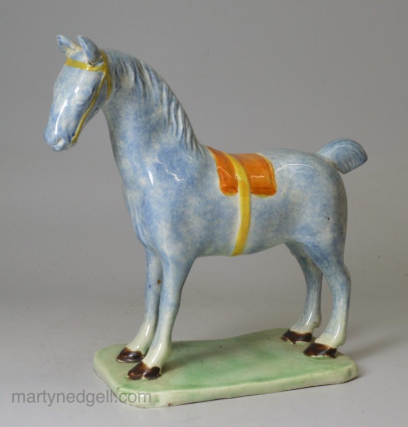 Pearlware pottery model of a horse decorated with colours under the glaze, circa 1820