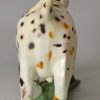 Creamware pottery cow creamer decorated with colours under the glaze, circa 1800