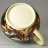 Mochaware cup decorated with swirled slip on a creamware pottery body, circa 1820