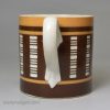 Small pearlware pottery slip decorated and engine turned mug, circa 1820