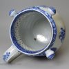 Pearlware pottery puzzle jug decorated with floral blue transfer prints under the glaze, circa 1820 Cambrian Pottery