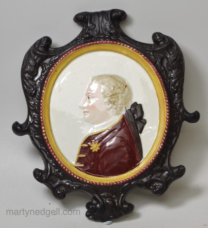 Pearlware pottery plaque moulded with the profile of King George III, circa 1790