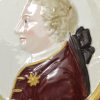 Pearlware pottery plaque moulded with the profile of King George III, circa 1790