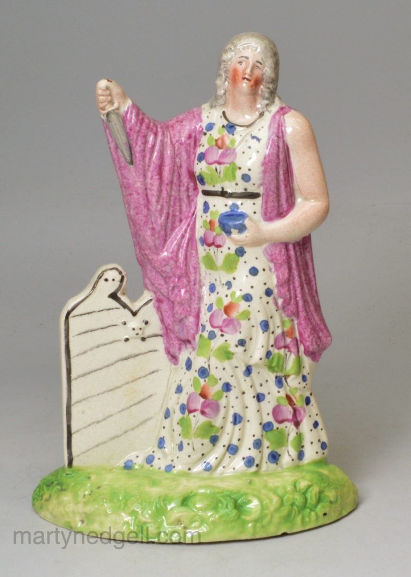 Creamware pottery figure of perhaps Lady Macbeth decorated with enamels over the glaze, circa 1820