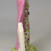 Creamware pottery figure of perhaps Lady Macbeth decorated with enamels over the glaze, circa 1820