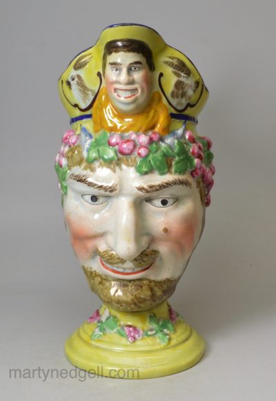 Pearlware pottery jug moulded as a bacchanalian satyr and decorated with enamels over the glaze, circa 1820