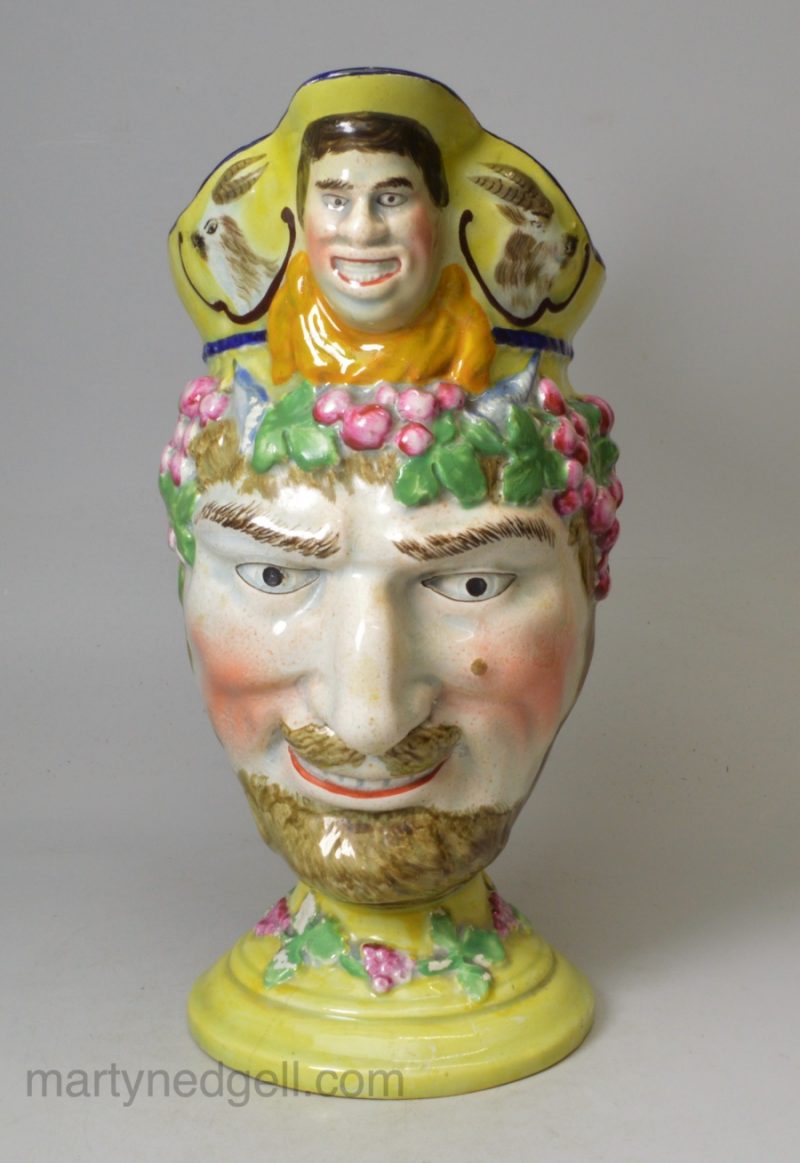Pearlware pottery jug moulded as a bacchanalian satyr and decorated with enamels over the glaze, circa 1820