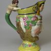 Pearlware pottery jug moulded as a bacchanalian satyr and decorated with enamels over the glaze, circa 1820