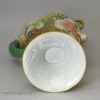 Pearlware pottery jug moulded as a bacchanalian satyr and decorated with enamels over the glaze, circa 1820