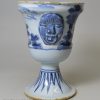 London delft small flower vase moulded with strange heads, circa 1720