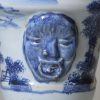 London delft small flower vase moulded with strange heads, circa 1720