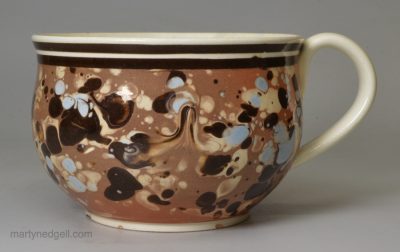 Slip decorated creamware pottery mug, circa 1800