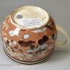 Slip decorated creamware pottery mug, circa 1800