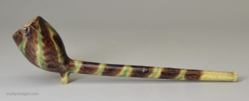 Pipe-clay pottery pipe decorated with Whieldon type colours under the glaze, circa 1780
