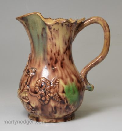 Creamware pottery cream jug decorated with Whieldon type colours under the glaze, circa 1770